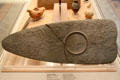 Egyptian predynastic mudstone carved palette for grinding eye paint with hunters' scene at British Museum. London, United Kingdom.
