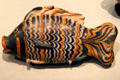 Polychrome glass cosmetic bottle in form of 'bulti'-fish found under floor in house in el-Amarna, Egypt at British Museum. London, United Kingdom.