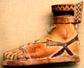 Greek terracotta scent-bottle in shape of sandaled foot said to be from Samos at British Museum. London, United Kingdom.