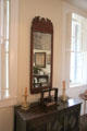 Mirror over chest with book press at Conde-Charlotte Museum. Mobile, AL.