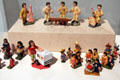 Painted earthenware people from El Salvador showing marimba band, market vendors & wedding figures at Tucson Museum of Art. Tucson, AZ.