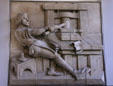 Relief showing early printing press at Gold Rush History Center. Sacramento, CA.