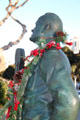 Bob Hope with microphone entertaining troops detail of National Salute to Bob Hope monument. San Diego, CA.