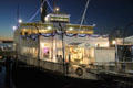 Passenger Ferry Berkeley at Maritime Museum outlined in lights. San Diego, CA.