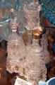 Three bottle caster set with toothpick holder in daisy & button + blockade patterns at Historical Glass Museum. Redlands, CA.