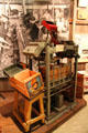 Paxton Junior Lidding Machine with Acme Flat Strapper machines used for crating citrus produce at Riverside Museum. Riverside, CA.