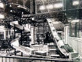 Print of Machinery Hall exhibit showing working conveyor system at Panama-Pacific International Exposition in private collection. San Francisco, CA.