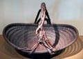 Shallow woven flower basket by Maeda Chikubosai I from Japan at Asian Art Museum. San Francisco, CA.
