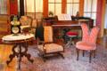 Square grand piano by W.P. Emerson of Boston plus table & chairs at Miramont Castle. Manitou Springs, CO.