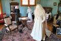 Bedroom with display of antique clothing at Miramont Castle. Manitou Springs, CO.