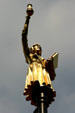 Woman with lamp, one of series of gilded statues on poles surrounding Old State House. Hartford, CT.