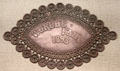 Souvenir Columbus tin plaque from Chicago World Columbian Exposition at Knights of Columbus Museum. New Haven, CT.