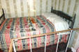 Antique bed on spot where Lincoln died. Washington, DC.
