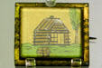 Log cabin campaign pin from 1840 election of William Henry Harrison in museum of old State Capitol. Tallahassee, FL.