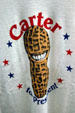 Smiling peanut on T-shirt boosts Carter for President in Jimmy Carter Presidential Museum. Atlanta, GA.
