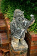 Gnome playing guitar in garden of Pebble Hill Plantation. Thomasville, GA.