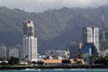 Honolulu skyline between Keola Lai condominium & Royal Capitol Plaza from sea. Honolulu, HI.