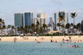 Hokua , round Nauru , 1350 Ala Moana & black & white Hawaiki Towers over beach of Waikiki. Honolulu, HI.