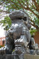 Chinese stone female lion with cub in Dr. Sun Yat-sen Memorial Park at entrance to Chinatown area of Honolulu. Honolulu, HI.