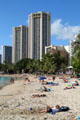 Octagonal twin Hyatt Regency Waikiki Towers over beach. Waikiki, HI.