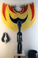 Hawaiian feather cape , Lei Niho Palaoa with carved whale tooth & stick image at Honolulu Academy of Arts. Honolulu, HI.