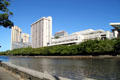 Ala Wai Canal from Hawaii Convention Center to distand condo towers. Honolulu, HI.