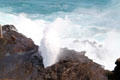 Column of water rises from Halona Point Blowhole. HI.