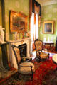 Fireplace & chairs in parlor at Dodge House. Council Bluffs, IA.