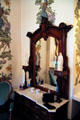 Dresser with mirror from walnut bedroom set displayed at 1876 Philadelphia Centennial Exposition at Dodge House. Council Bluffs, IA.