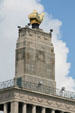 Golden flame & garlands atop Veterans' Memorial & City Hall. Cedar Rapids, IA.