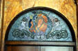 Stained glass window of woman with torch over entrance of Auditorium Building. Chicago, IL.
