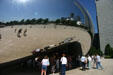 Cloud Gate provides a 12-foot-high arch through the 66-feet long by 33-feet high reflective sculpture in Millennium Park. Chicago, IL.
