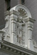 Roofline details of carved woman wearing lion skin on Teutonia Insurance Co. Building. New Orleans, LA.