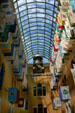 New Atrium between wings of Massachusetts State House with flags of the state's cities. Boston, MA.