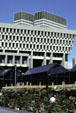 Boston City Hall over Faneuil Hall flower market with John F. Kennedy Building by Architects Collaborative beyond. Boston, MA.