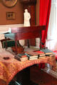 Longfellow's New England mahogany & white pine standing desk with statue of Goethe at Longfellow National Historic Site. Cambridge, MA.