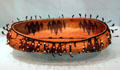 Pomo elliptical basket with quail plumes & beads at Peabody Museum. Cambridge, MA.