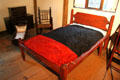 Rope bed, cradle & chairs in bedroom at Witch House. Salem, MA