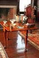 Drop-leaf table with books & China in Paneled Room at Peacefield. Quincy, MA.