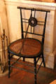 Caned side chair in music room at Gibson House Museum. Boston, MA.