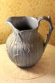 Ceramic pitcher sculpted with rushes in dining room at Orchard House. Concord, MA.