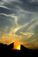 Sun sets between pyramids of National Aquarium. Baltimore, MD.