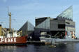Ships of Baltimore Maritime Museum along side National Aquarium. Baltimore, MD.