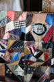 Crazy quilt in Mrs. Kyle's bedroom at Campbell House Museum. St. Louis, MO.