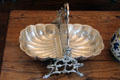 Silver plated biscuit holder with fold down serving halves at Vaile Mansion. Independence, MO.