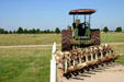 Steam tractor with plow on prairie landscape of Stuhr Museum. Grand Island, NE