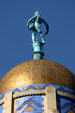 Statue of pioneer sowing grain atop Nebraska State Capitol. Lincoln, NE.
