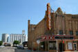Fox Theater against North Platte grain elevators. North Platte, NE.