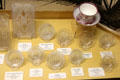 American pressed glass cup plates used hold tea cups after tea was poured into saucers to cool at Museum of American Glass. Milville, NJ.
