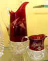 King's Crown glass pitchers with upper area ruby color by Adams & Co. of Pittsburgh, PA at Museum of American Glass. Milville, NJ.